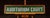 Stained glass transom panel reading "AUDITORIUM COURT," executed in white glass lettering set against a mottled green...