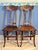 This elegant pair of antique chairs, dating to the early 20th century (circa 1900), is crafted from solid quarter-sawn oak...