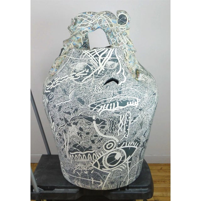 This monumental ceramic floor vase with still life and abstract carved motifs in the sgraffito technique dates from the...