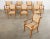 Gorgeous set of eight hand-crafted beech dining armchairs made in the grand English Regency taste. The chairs feature...