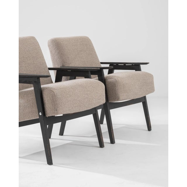 This pair of 1960s armchairs epitomizes the restful equilibrium of Czech Modernist design. The bold geometries of the...
