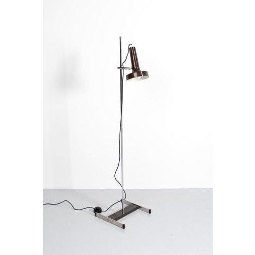 Danish vintage floor lamp from the seventies with a adjustable spot made of brown lacquered aluminum. A few traces of use...