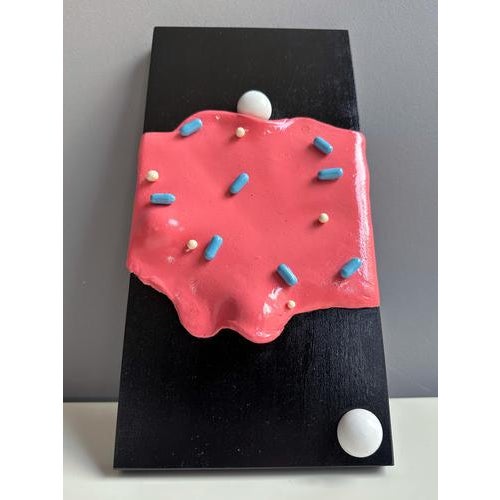 The work presents a low-relief surface modelled in foam clay and finished with layers of acrylic and enamel that amplify...