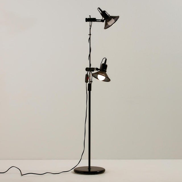 Metal floor lamp from the 1980s with two lampshades. The angle and height of the lampshades are adjustable, making it...