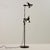 Metal floor lamp from the 1980s with two lampshades. The angle and height of the lampshades are adjustable, making it...