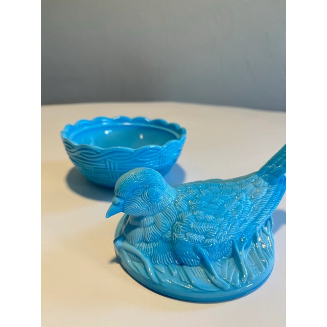 Vintage milk glass candy dish featuring a bird sitting on nest. Bird is the top and nest is the bottom of dish. Marked on...