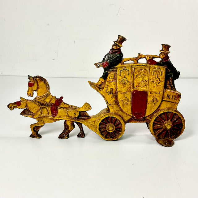 Vintage Home is pleased to present this Early 20th Century Antique Doorstop. It’s British and features a stage coach with...