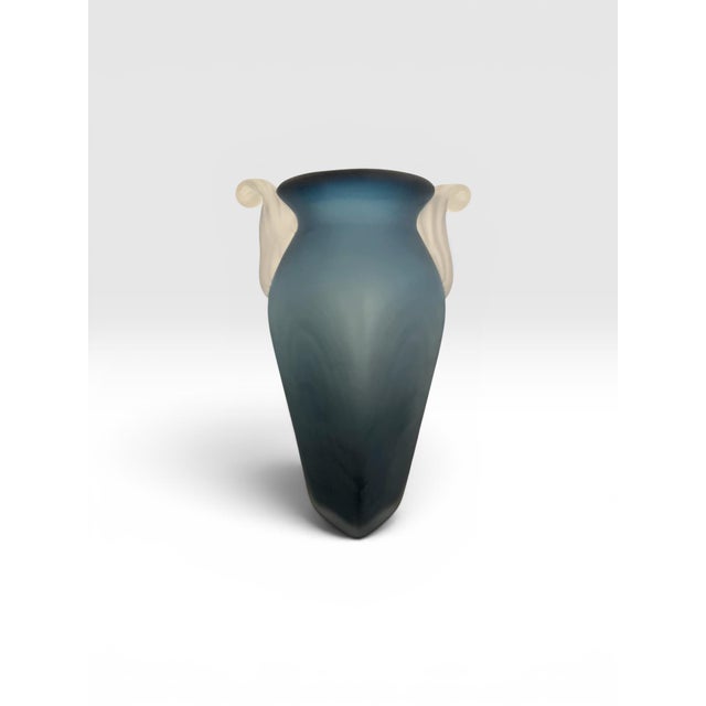 A striking signed studio art glass vase by acclaimed contemporary glass artist Steven Newell. This hand-blown vessel...