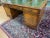 This Large 72 Inch English George II Style Burl Walnut Leather Top Partners Desk features an antique brass handle finish...