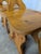 This set of four wooden chairs is made in a traditional Tyrolean style, featuring solid wood construction and heart-shaped...