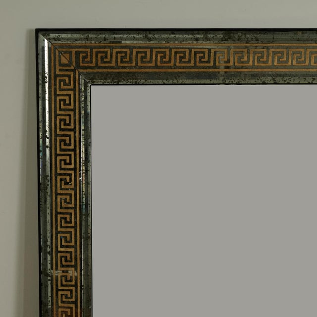 Impressive large Italian wall mirror with distressed mirrored panels featuring reversed gilt decorated Greek key designs...