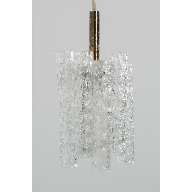 Doria Leuchten pendant lamp from the 60s. Made with glass tubes white lacquered frame and brass, the brass tube is a bit...