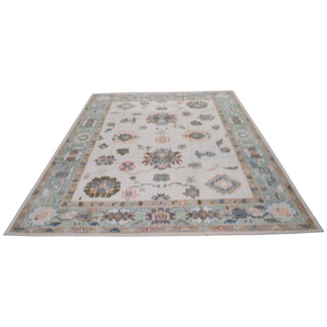 Hand-knotted with care using traditional rug-making techniques, this wool rug blends timeless craftsmanship with a modern...