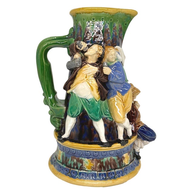 An Early Minton Majolica 'Tavern' Ale Jug, formed as a tapering medieval flagon, the figures molded in high relief and...