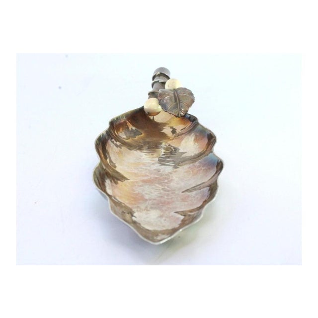 Hammered Silver and Gold Leaf-Shaped Bowl with Handle Applications, in Very Good conditions. Designed 1980 to 1989 This...