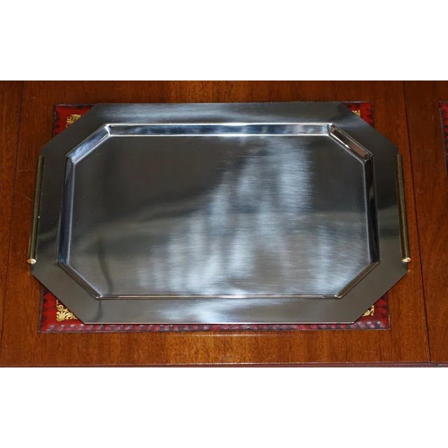 A lovely Van Cleef & Arpels tray in chrome with gold gilt handles A good looking and highly decorative serving tray which...