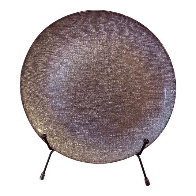 A glamorous set of four Turkish art glass plates attributed to Akcam, featuring a richly textured crosshatch surface with...