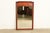 A gorgeous Mid-Century Modern Hollywood Regency Campaign style carved walnut framed wall mirror By Thomasville USA, 1977...