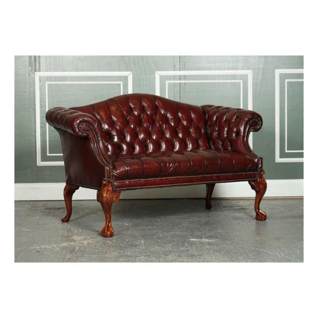 Stunning hand-dyed burgundy hump or camel back regency style chesterfield fully buttoned two-seater sofa. A very stunning...