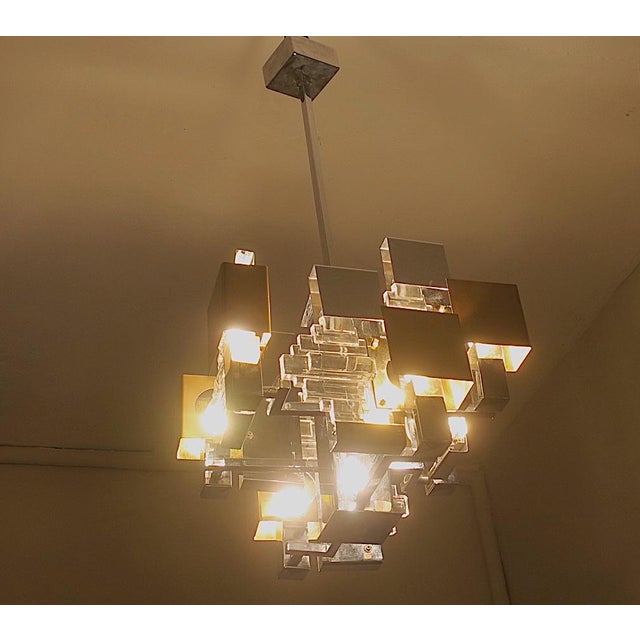 Gaetano Sciolari Italian Modern Cubist chandelier in chrome, brass overlay and thick art glass, Italy 1960s. Rare mid...