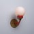 Italian wall sconce dating from the 1950s, characterized by a bold geometric composition and a distinctive contrast of...