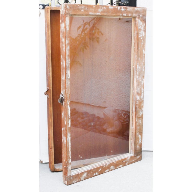 Vintage Shadow Box Display Case. The frame is made of an old wood/glass window with a hinged door. Inside surface is a...