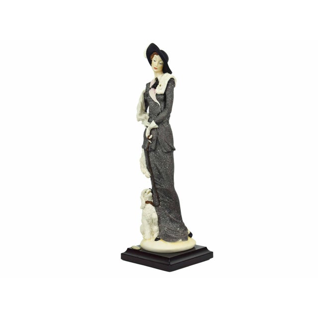 Evoke the glamour of a bygone era with this exquisite 1987 Giuseppe Armani masterpiece, titled "Lady with Poodle." Crafted...