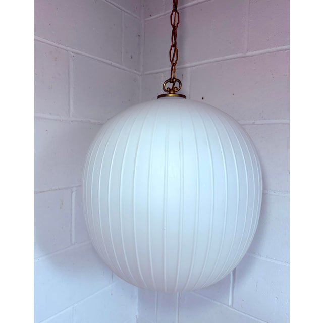 The Vintage Bologna Pendant Lamp by Aloys F Gangkofner is a rare and collectible piece from 1954, embodying the Mid-...