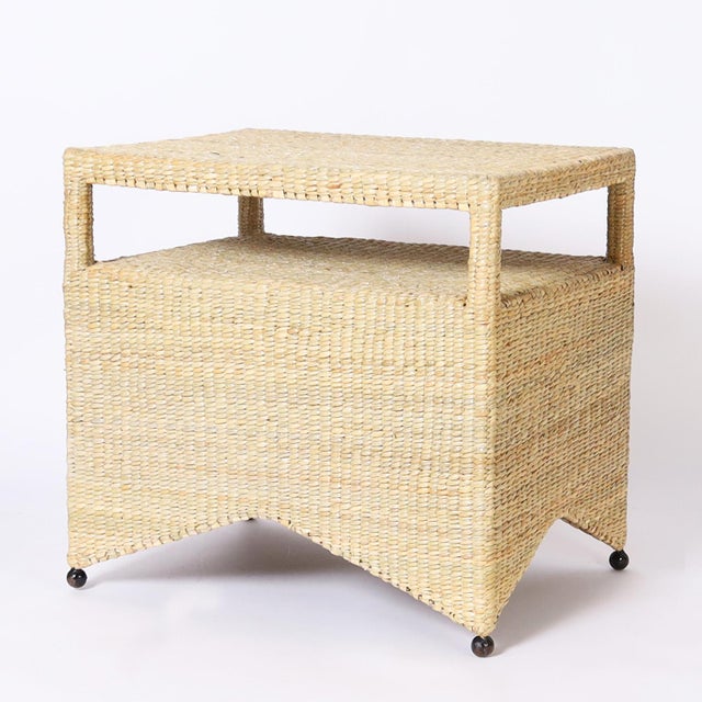 Chic pair of wicker stands or tables with two tiers crafted in reed expertly wrapped over a sturdy metal frame with ball...