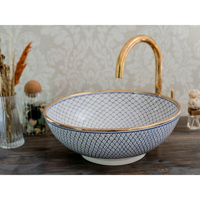 1) Elevate the Beauty of your bathroom with our 14k Gold Rim Sink. This ceramic vessel sink is skillfully handcrafted by...