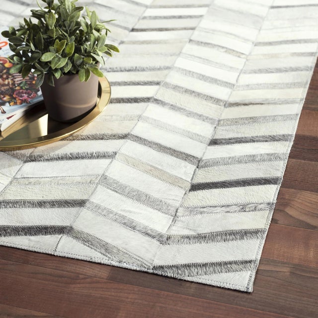 The Galaxy Collection provides a fresh take on classic chevron design. Hand-stitched by skilled artisans. These rugs are...