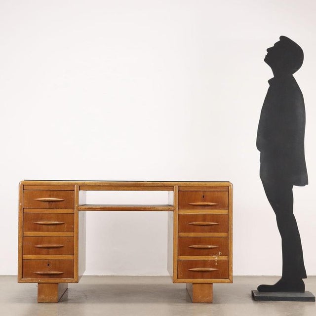 Vintage 20th century desk in oak veneer with green and black multicolored glass top, undercounter compartment and double...