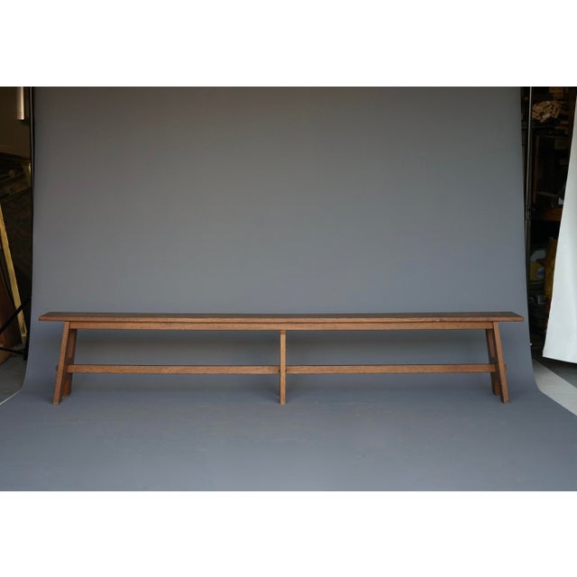 An elegant Dutch bench, circa 1940s. Designed in the Bossche School style, this bench was designed for a church interior....
