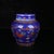 Compact Chinese porcelain ginger jar with a striking deep blue ground, finished with colorful doucai enamel and delicate...