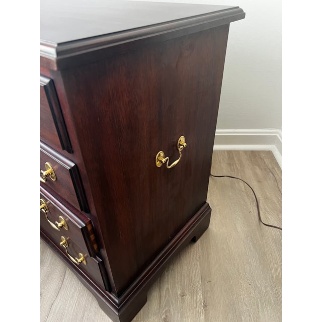 Henkel Harris chairside chest in solid mahogany with #29 finish. A compact, elegant piece designed to sit beside a chair...