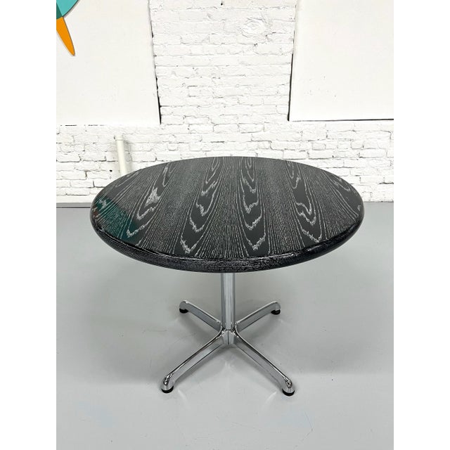 This started out as a golden oak topped table, but we decided it was a great candidate for cerusing it in dark gray and...