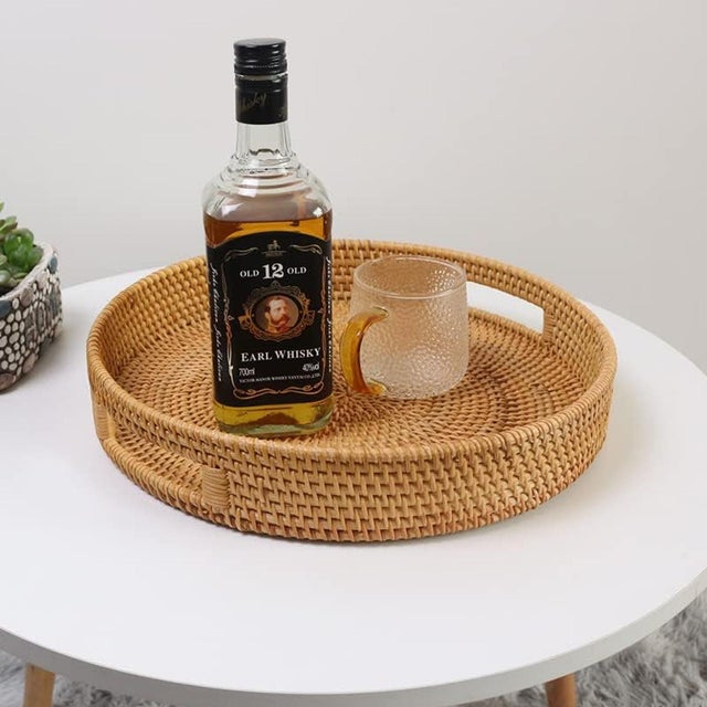 Bring natural warmth and texture to your space with this handwoven rattan serving tray. Crafted from 100% natural rattan,...