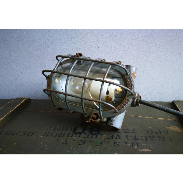 This grey industrial wall/ceiling lamp, model E3293 from Schaco, also known as the 'Tortoise Lamp', dates from the 1930s....