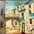 A large oil painting in a giltwood frame depicting a quiet street in an old Spanish town. The narrow road is lined with...