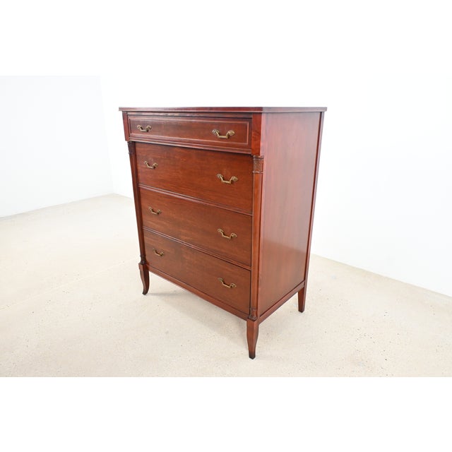 This vintage Federal-style chest by Rway Furniture Company features fluted pilasters, tapered legs, and a warm mahogany...