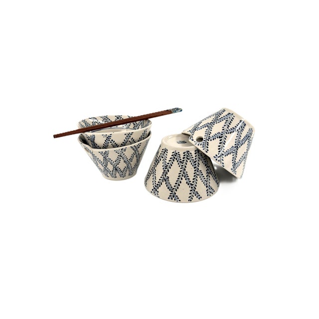 A beautiful set of four Bat Trang ceramic bowls, handcrafted in Vietnam and decorated with an elegant cobalt blue...