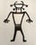 Unique laser cut metal figurine depicting a Petroglyph Rock Art Silhouette of the Sun Head Man or Sun Face Spirit. The...