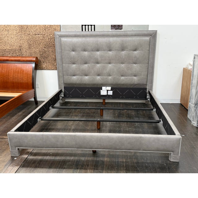 Design Plus Gallery presents an Eastern King Size Tufted Nailhead Bed Frame from Ethan Allen. This bed is designed with a...