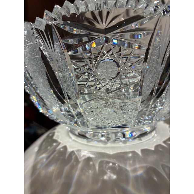 American Brilliant Period style cut lead crystal bowl. It features intricate, hand cut patterns, including hobstars and...