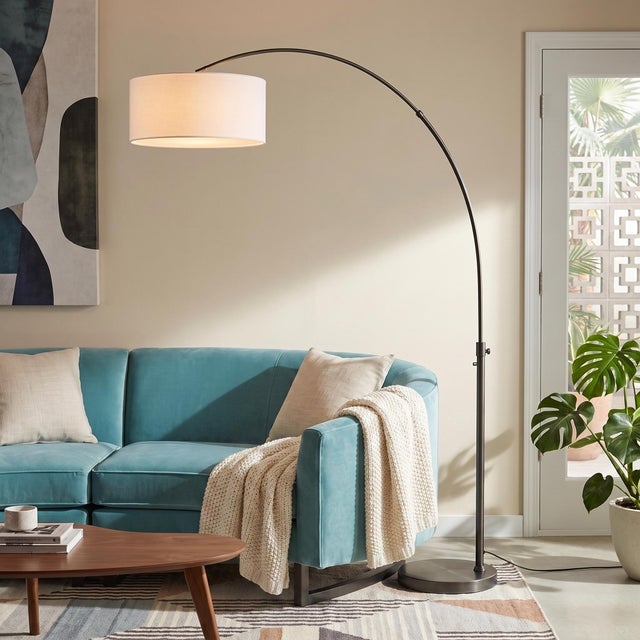 The Float Arc Lamp is a modern arc lamp designed by Peter Morelli in 1960, featuring a sleek black nickel finish and a...