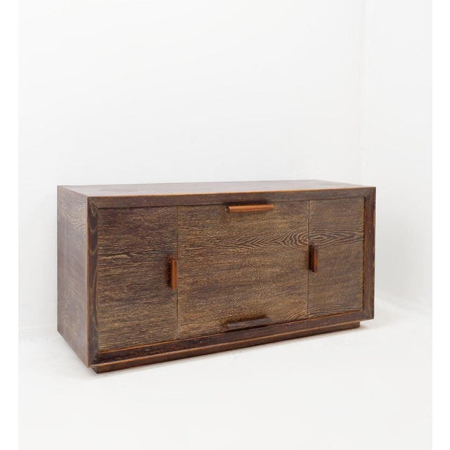 Modernist - Bar - Sideboard Measures : 130x38cm H:60cm 2 side-opening doors1 central bar with downward opening. Veneered...