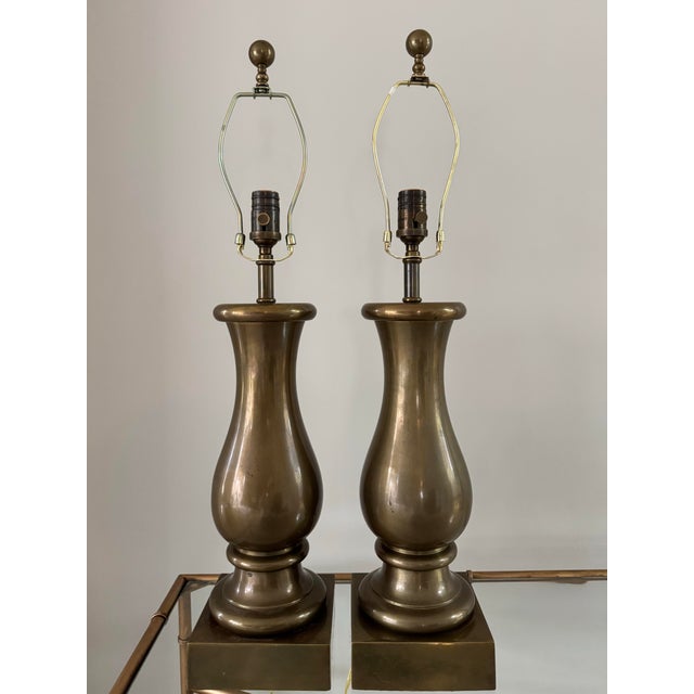 A fabulous pair of heavy bronze table lamps by Visual Comfort offer classic, yet modern style. Felt bottoms. Harps and...