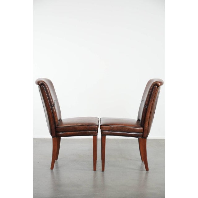 We are offering this comfortable set of 2 sheepskin dining chairs with character and beautiful warm colors. This wonderful...