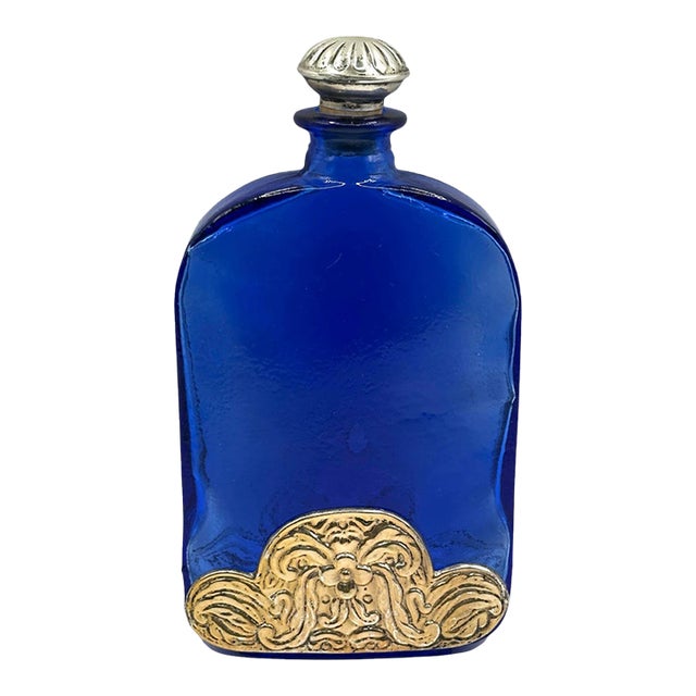 Vintage Cobalt Blue Spanish Art Glass Flask With Ornate Embossed Scrollwork Medallion For Sale