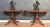 Pair of Regency hall tables, the well figured mahogany tops supported on turned columns. All raised up on four saber legs,...